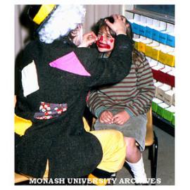 Primary school student being painted in art education class