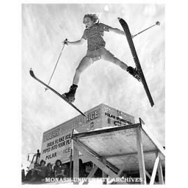 Student using ski-jump and man-made snow near Halls of Residence