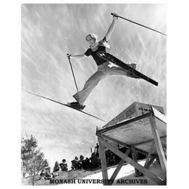 Student using ski-jump and man-made snow near Halls of Residence