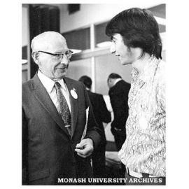 Harry Green (left), inaugural blacksmithing teacher talks to Paul Ramler, President Student Union Council at the Caulfield Institute of Technology 50th anniversary celebrations