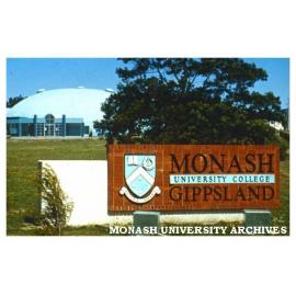 Entrance sign for Monash University College Gippsland. Binishell in background.