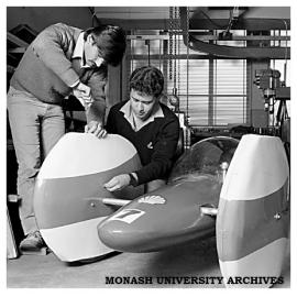 Mechanical Engineering students Mr Dominique Adrien and Mr Dennis Stathos at work on the new wheel fairings of the Chisholm 80