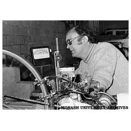 Chisholm spanner man, Ian Dent, checking Chisholm 80's tuning on the pit dynamometer