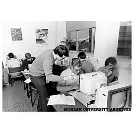 John Symington, lecturer with the Division of Information Technology, advising student on Information Modelling course for Telecom staff at Pearcy Centre