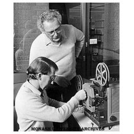 Mr Nobby Clarke, of the Educational Development Unit, offering advice to Mr Bryan Baker, Accounting Lecturer and a participant in the 16mm Projectionist Course