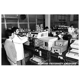 Water Studies Centre (WSC) Research Associate, Dr On Sin (left) with the Institute of Drug Technology's Head Chemist Mr Greg Jordan, demonstrating a high performance liquid chromatograph