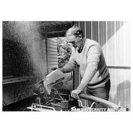 Chisholm Art Education lecturer, Mr Bob Greaves, with a portable bandsaw