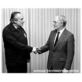 Property Supervisor Mr Jim Gorse (left) being congratulated by Acting Director Mr Gerry Maynard on 27 years service to Chisholm Institute of Technology