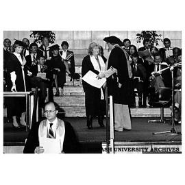 Ms Kay Rundle receiving her Graduate Diploma in Computing at the Chisholm Faculty of Technology conferring ceremony on 13 May at Dallas Brooks Hall