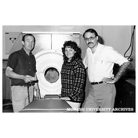 Dr John Davis and Dr Peter Wells of Chisholm Applied Physics Department with Masters student Ms Pam Shadbolt and the CATscan they use for structural analysis of building materials and fossils