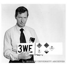 Chisholm Safety Officer Mr Alex Glennie with one of the new HazChem signs being used on the Caulfield and Frankston campuses