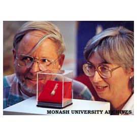 Husband and wife paleontologists Dr Tom Rich, Museum of Victoria, and Professor Pat Vickers-Rich, director of Monash University Science Centre, observe the jawbone fossil of Ausktribosphenos nyktos