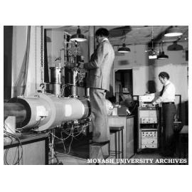 Professor Ron Brown (left) and chemistry lecturer Dr Peter Godfrey adjust apparatus designed to investigate glycine