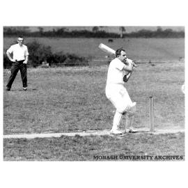 First Monash University cricket match, Vice-chancellors XI v Students XI, 28 November 1961. Doug Ellis looking for ball.