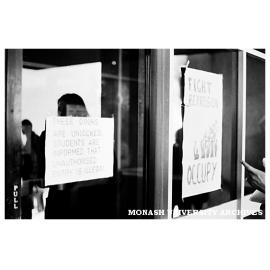 Student protest signs on Administration building doors