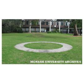 Science courtyard with Clive Murray-White sculpture 'Retrospective 1970-1993', a turf mound and concrete annulus.