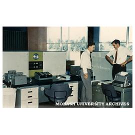 Prof Noel Murray (right) and unknown with Ferranti Sirius mainframe computer, housed in Engineering.