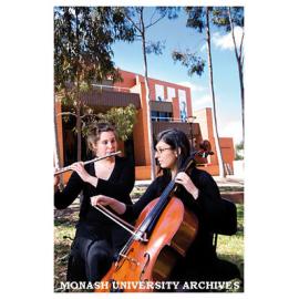Chamber music students Amy Tcheupdjian (cello) and Surekha Curkpatrick (flute) in the forecourt of the Performing Arts Centre with Robert Blackwood Hall in the background
