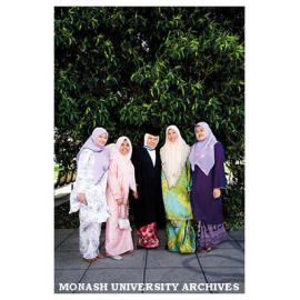 Graduate and family in grounds of Clayton campus