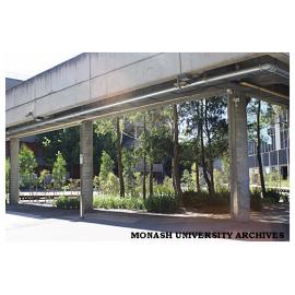 Courtyard in front of Monash University Museum of Art (MUMA), with level 2 walkway in foreground