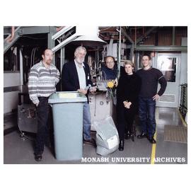 Materials Engineering research fellows and staff with newly developed garbage bin, created from post-consumer bottle grade HDPE.