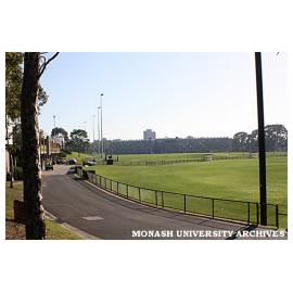 Playing fields with Sports and Recreation Centre (left) and Briggs Hall (background), Clayton campus.