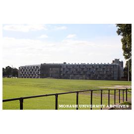 Briggs Hall with playing fields in foreground, Clayton campus