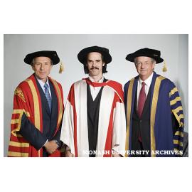 Chancellor Dr Alan Finkel (left) with Nick Cave and Vice-Chancellor Professor Richard Larkins after award of honorary Doctor of Laws