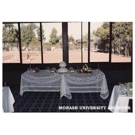 Interior of Monash University Club with tennis courts in background