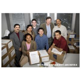 Books for Kabul volunteer packers. Back row (left): Mr Ahmad Sarmast, Ms Jowati Juhary, Mr David Treisman, Mr David Templeman, Mr Dinesh Kumar. Front row (left): Ms Jimaima Lako, Mr Guibin Zhang, Mr Sanjeev Veloo.