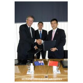 Vice-Chancellor Richard Larkins, Victorian Treasurer John Brumby and Aluminium Cooperation of China (Chalco) chief executive officer Mr Xiao Yaqing, after signing a Memorandum of Understanding.