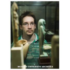 Archaeology honours student Daniel James, inaugural Homer Le Grand scholarship winner, with Egyptian Ushabti figure of Pa-Abu-Mekh.