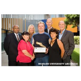 Winners of the 2005 Global Corporate Challenge Dr Bala Balanchandran (left), Ms. Lorraine Foxall, Dr Jill Grogan, Mr Peter Lausch, Mr. Martin Doulton, Ms. Rosemary Demirtas with Mr. Herb Elliott.