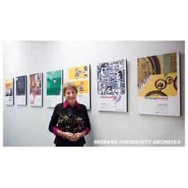 Suzanne Wolf with student art promoting Health, Wellbeing and Development messages at Mamadukes Cafï¿½, Caulfield campus
