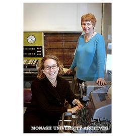 Historian Sarah Rood (seated) and Dr Judy Sheard in the Monash Museum of Computing History, with Ferranti Sirius computer in background