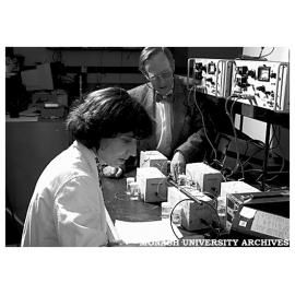 Dr Brian Cherry with PhD student Zita Lourenco, measuring chloride content by an electrical method in laboratory-sized reinforced concrete blocks
