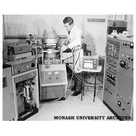 Dr Bryan Gatehouse with first mass spectrometer in Department of Chemistry