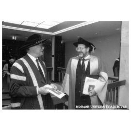 Deputy Chancellor Dr Geoffrey Knights and honorary graduate Dr Richard Divall (right)