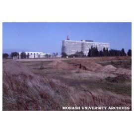 Menzies Building under construction; Main Library and Administration Building at left