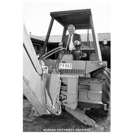 Head of the Department of Community Medicine, Professor Neil Carson, in backhoe at the site of the department's new extension in East Bentleigh