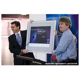 Greg LeBlanc, Lead Accelerator Physicist at the Australian Synchrotron, with the Honourable John Brumby, Minister for Innovation (left), announcing the achievement of first light