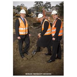 Professor Colin Chapman, dean of the Victorian College of Pharmacy (left) with the Minister for Innovation and State and Regional Development John Brumby (centre) turning the first sod at the site of building works at the Parkville campus