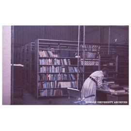 Kathleen Thomson working in the Monash Library in the Volkswagon factory