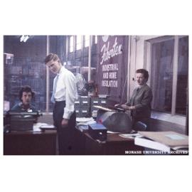 Myrtle Spottiswood, Murray Frazer and Anne Frazer in the Monash Library in the Volkswagon factory