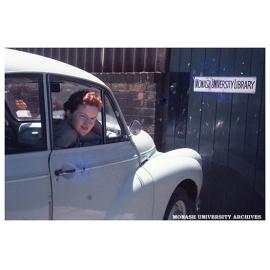Anne Frazer outside the entrance to the Monash Library in the Volkswagon factory