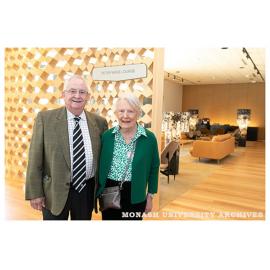 Former General Manager, Peter Wade, with wife Jan Wade outside the Peter Wade Lounge in the Chancellery Building, Clayton campus